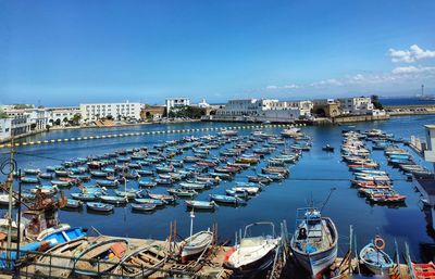 High angle view of boats moored at harbor