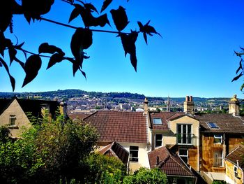 View of townscape against blue sky