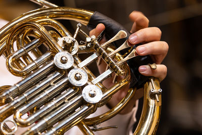 Close-up of hand holding chain