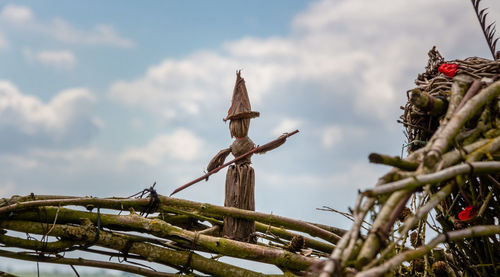 Low angle view of wicker art against sky