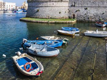 High angle view of boats moored at harbor