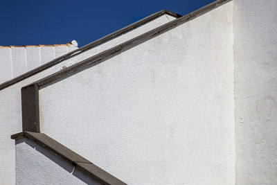 Low angle view of building against blue sky