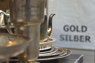 Close-up of antique silver utensils at store
