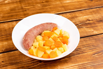 High angle view of chopped fruits in bowl on table