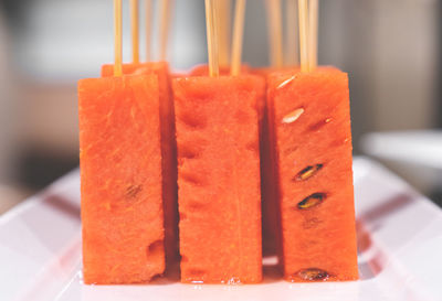 Close-up of orange slice in plate