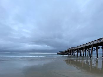 Pier over sea against sky