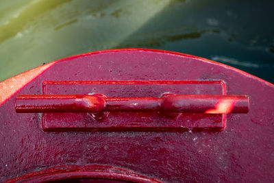 Close-up of red clamp on boat