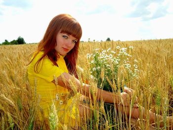 Portrait of young woman in field