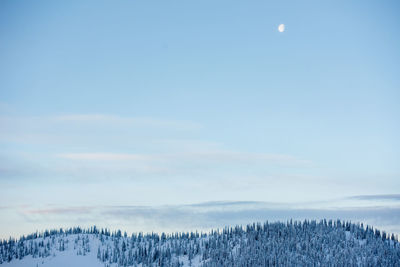 Beautiful moonrise over the snowy peaks.