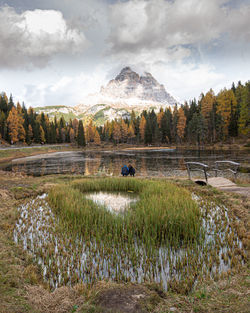 Lake of lago di antorno with tre cime di lavadero mountain in autumn. forest landscape  italy