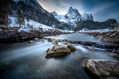 Scenic view of snowcapped mountains against sky