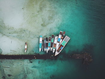 High angle view of illuminated building by sea