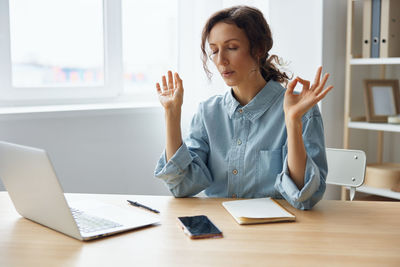 Businesswoman working at desk in office