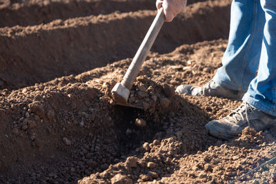 Low section of man working at construction site