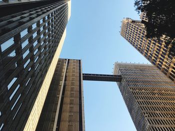 Low angle view of skyscrapers against clear sky