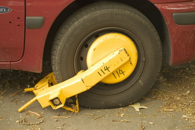 Close-up of yellow vintage car on road