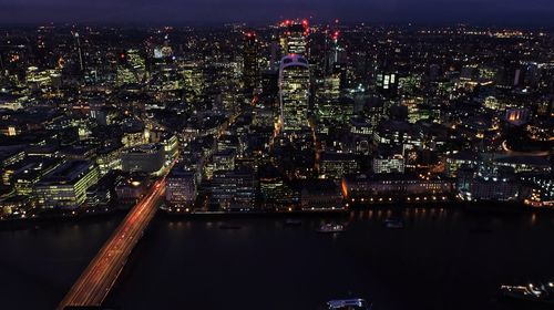 Aerial view of illuminated city at night