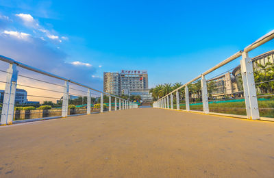 Walkway against sky