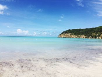 Scenic view of sea against blue sky