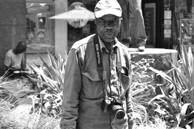 Portrait of man standing outdoors