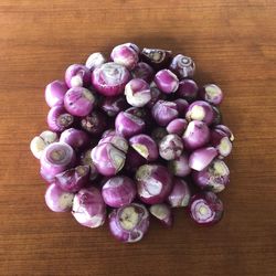 High angle view of purple berries on table