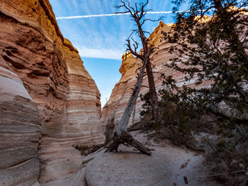 Low angle view of rock formation against sky