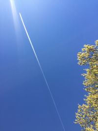 Low angle view of vapor trails in sky