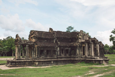 Old temple against cloudy sky