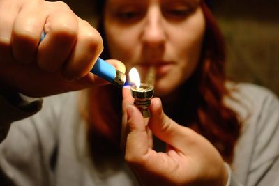 Midsection of woman holding cigarette