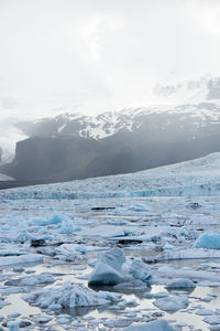 Scenic view of frozen lake against sky