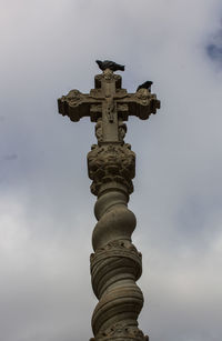 Low angle view of statue against sky