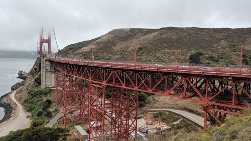 View of bridge against cloudy sky