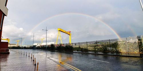 Rainbow over water against sky