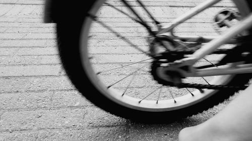 Cropped image of bicycle on street