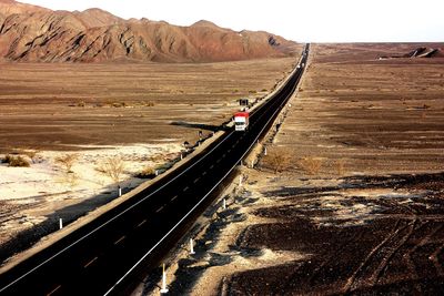 High angle view of road amidst landscape against sky