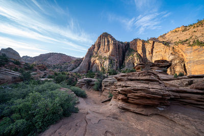 Rock formations on landscape against sky