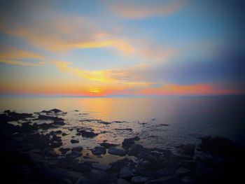 Scenic view of sea against sky during sunset