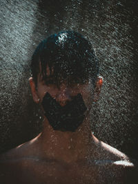 Close-up portrait of young man in water