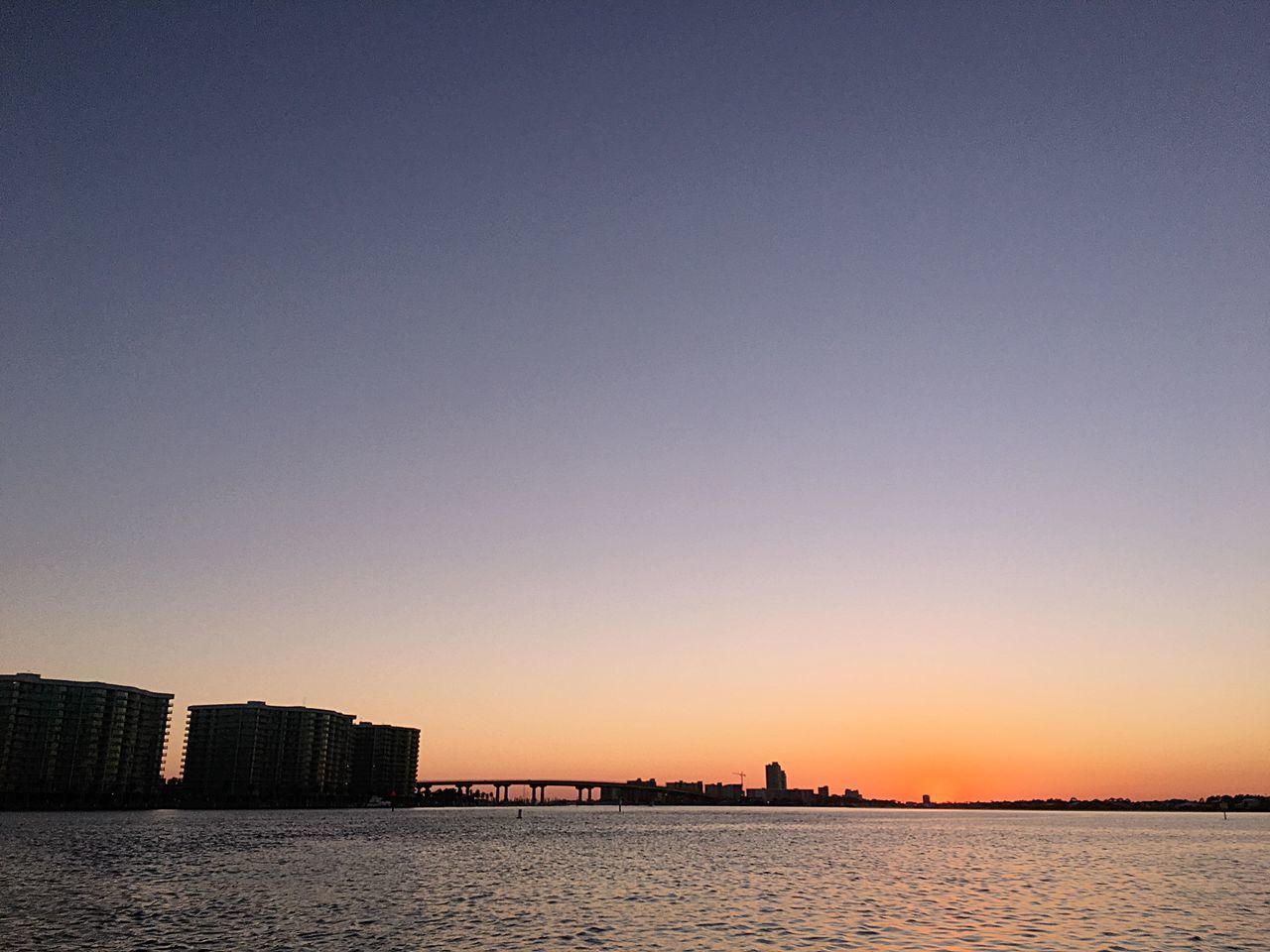 sky, sunset, copy space, clear sky, water, architecture, built structure, building exterior, waterfront, nature, no people, city, orange color, beauty in nature, building, outdoors, scenics - nature, sea, tranquility