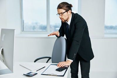 Young man using laptop on table