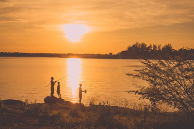 Scenic view of sunset over lake