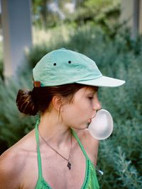 Portrait of young woman wearing hat