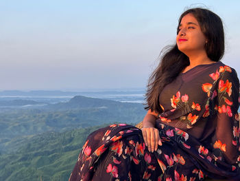 Young woman looking at mountain