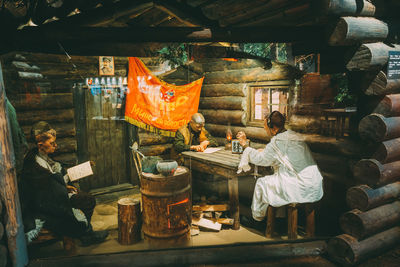 Rear view of people at market stall