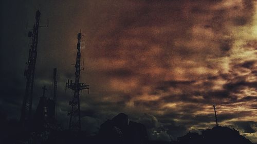 Low angle view of power lines against sky