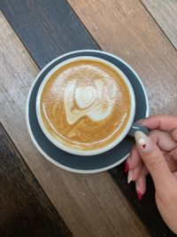 High angle view of coffee cup on table