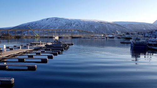 Scenic view of lake against clear blue sky