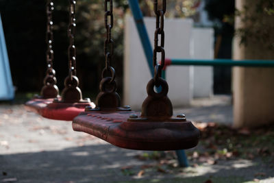Empty swings hanging at playground