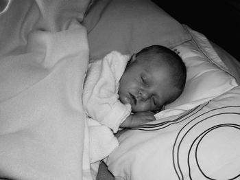 Cute baby sleeping on bed