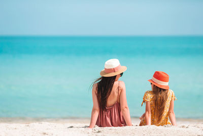 Rear view of people on beach